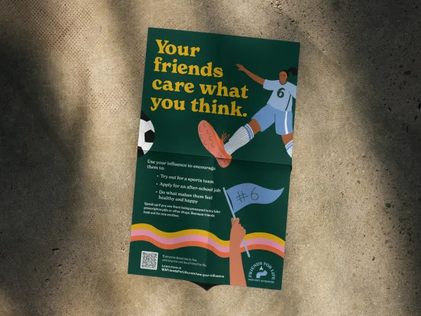 Poster of a person in a blue shirt and a hand holding a blue flag