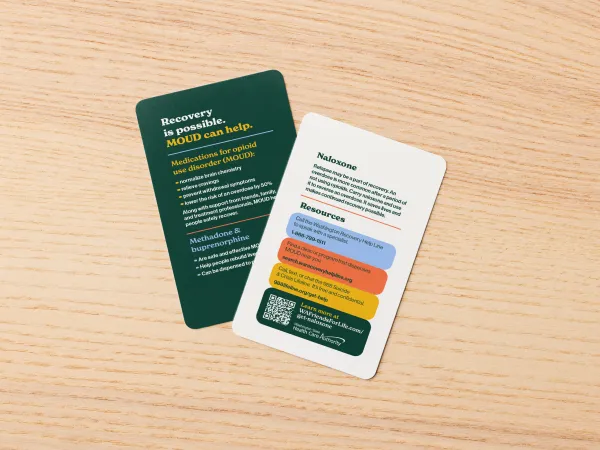 Image of a wallet card with one side on a dark background and the other on a light background with information about medications for opioid misuse disorder